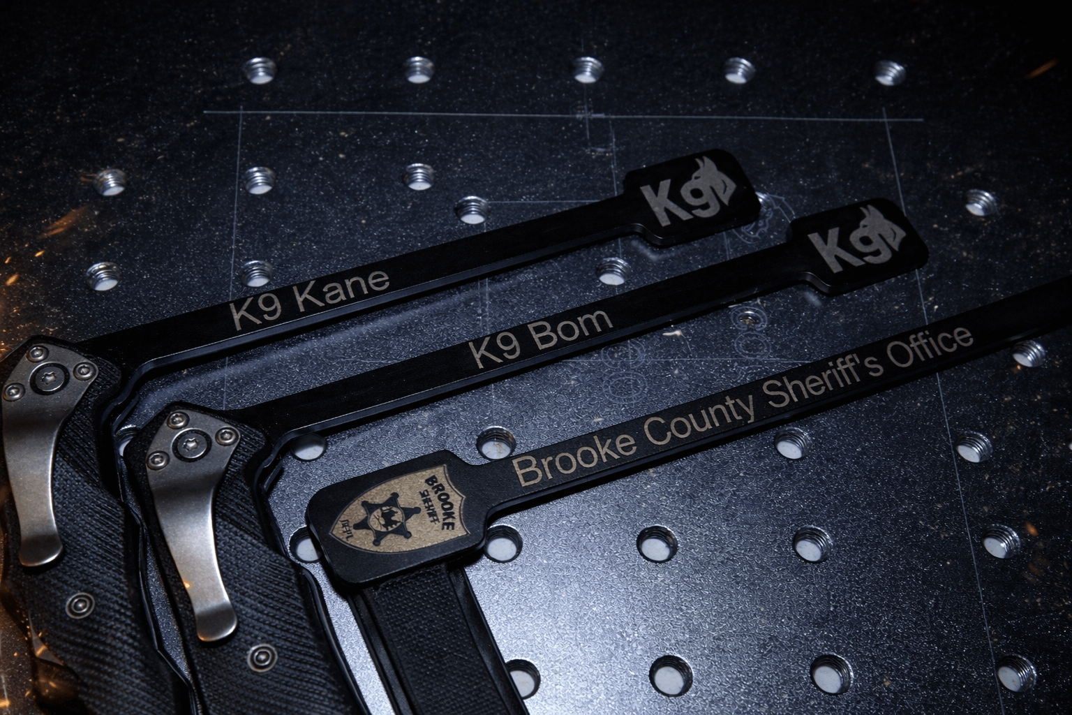 Engraved Outstick for K9 training, featuring names K9 Kane and K9 Bom, plus Brooke County Sheriff's Office branding.